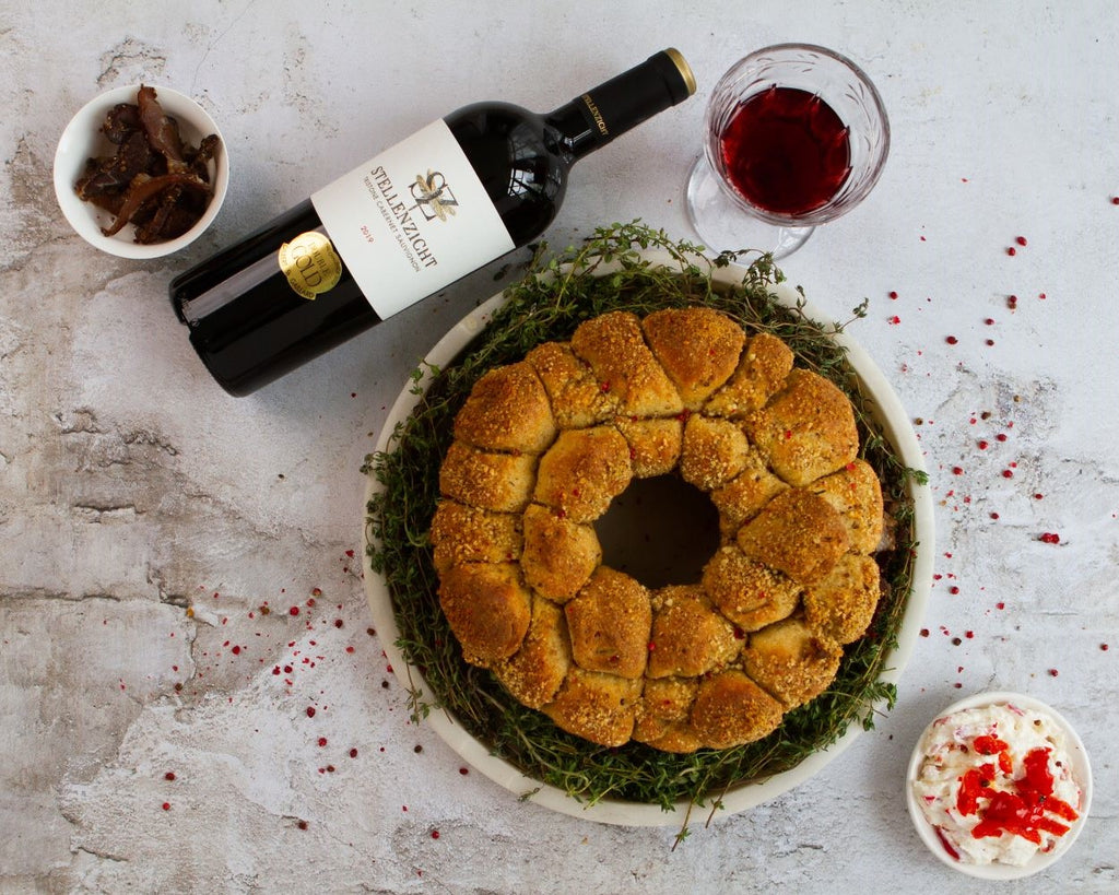 The Christmas Menu Starter: Biltong pull-apart bread wreath with a creamed cheese and peppadew spread.